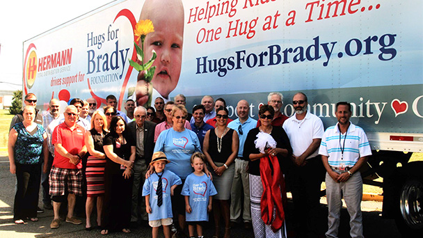 Hugs for Brady at Hermann Trucking